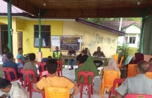 Babinsa Koramil 01/Sukajaya Bersama Bhabinkamtibmas Hadiri Kegiatan Musyawarah Desa Binaan