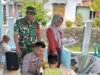 Babinsa Koramil 02/Sukakarya dan Bhabinkamtibmas Dampingi Pelaksanaan Posyandu di Gampong Kuta Timu