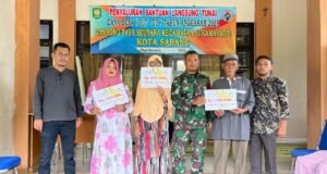 Babinsa Koramil 02/Sukakarya Monitor Penyaluran BLT-DD untuk Perkuat Kesejahteraan Warga di Gampong Binaannya